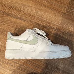 Nike Air Forces with sage green and gold details